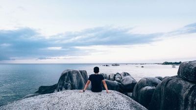 man gazing at the ocean