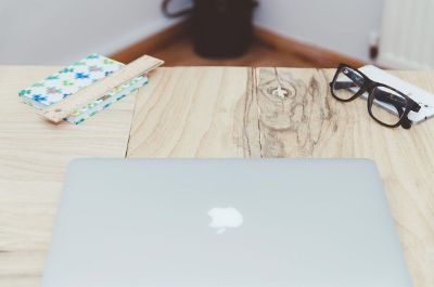apple laptop on table