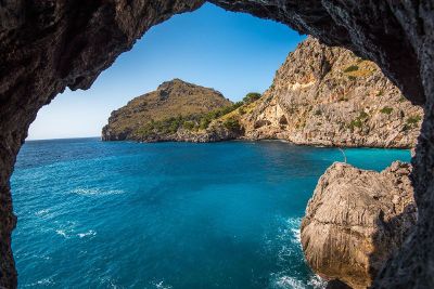 water outside of a cave