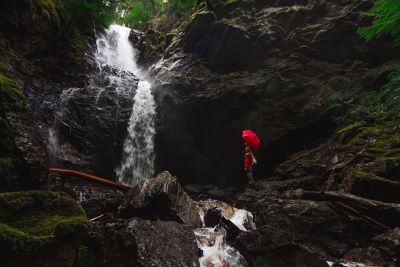 hiker near waterfall