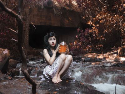 girl holding glass jar