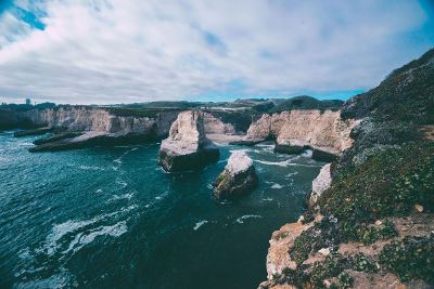 lake surrounded by cliffs