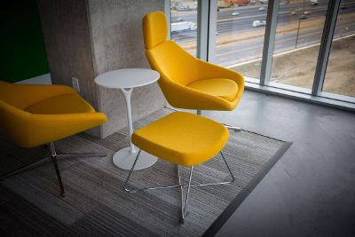 yellow chairs white table gray floors