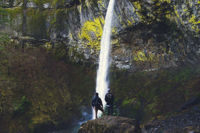 people in front a cascade