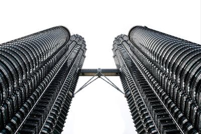 twin skyscrapers with a connecting bridge