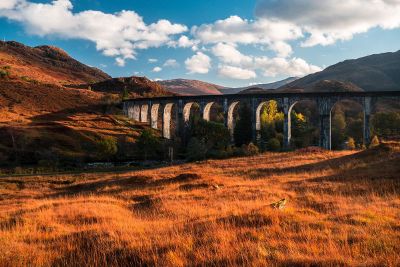 stone bridge through a valley