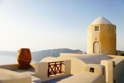 a pot by a yellow building