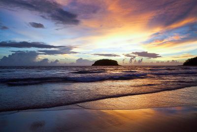 sunset over a rolling ocean