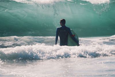 surfer facing a wave