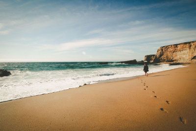 person walking on a beach