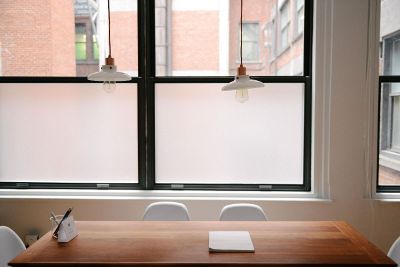 office room with a table and two light bulbs above