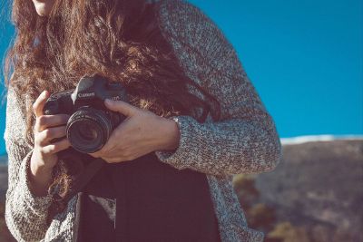 girl holding cannon camera