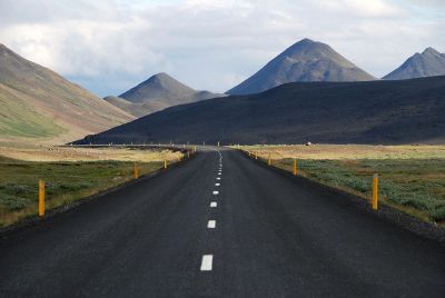 road with mountains in background