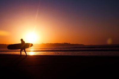 a surfer with his surfboard