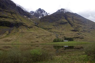 isolated house surrounded by mountains