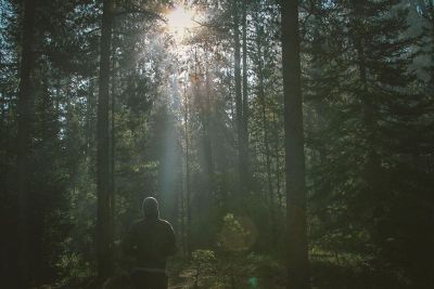 man standing alone at sunrise