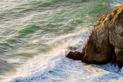 water crashing into rock