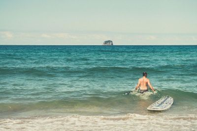 a man surf the beach