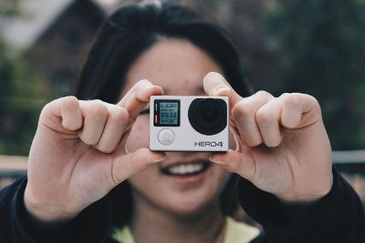 holding a gopro