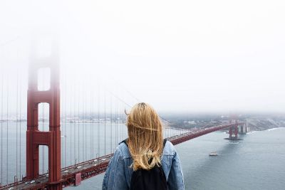 woman looking at golden gate bridge