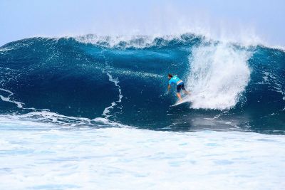 surfer rides a wave