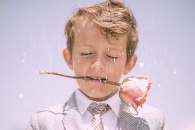 boy in suit with a rose