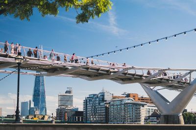 people walking on a bridge