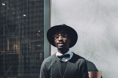 man with glasses and a hat