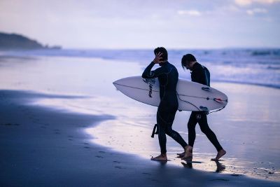 surfing guys at beach