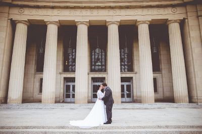 married couple kissing near post office