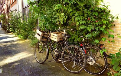 bicycles leaning against a wall