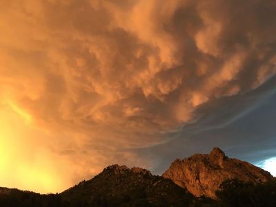 huge cloud formation over mountain