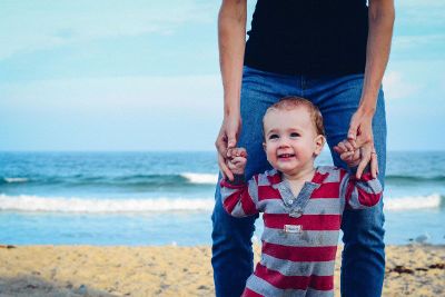 dad helps baby walk