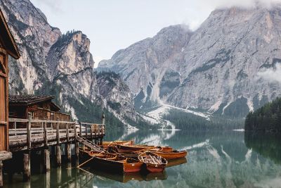 lake with boats and mountains