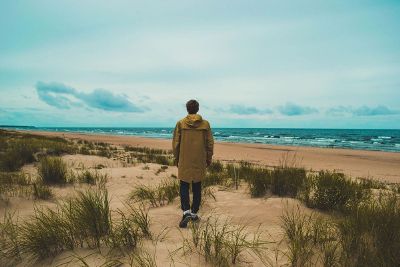 man lookout out to ocean