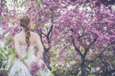 girl in wedding dress amongst flowers