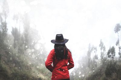 person in red under snow fall