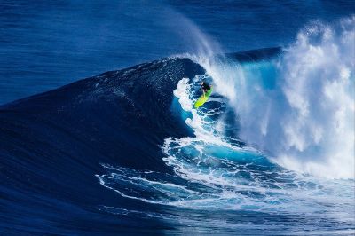 surfer inside curl of wave