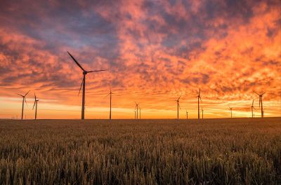 beautiful sunset over windmill farm