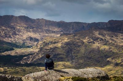 a man sitting on the rock