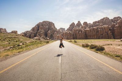 lady jumping in road