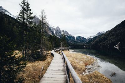 mountain lake with wooden walkway
