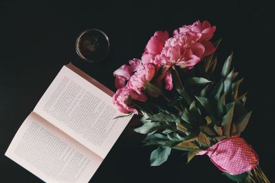 picture of flowers beside book