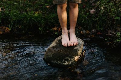 person standing on a rock