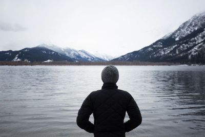 person viewing snow covered mountains