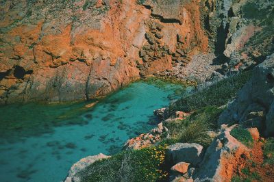 blue water between mountains