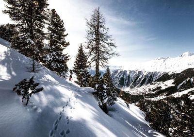 footprints on a snow covered mountain