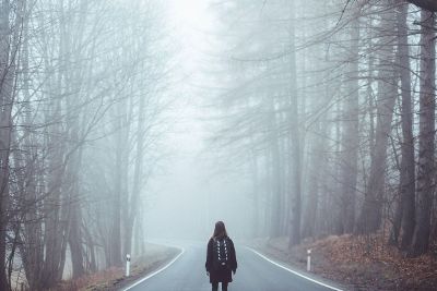 girl walking in fog