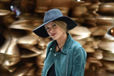 woman with hat dressed in blue