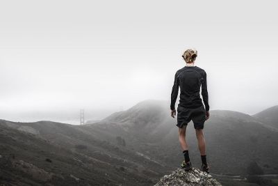 hiker in foggy mountains